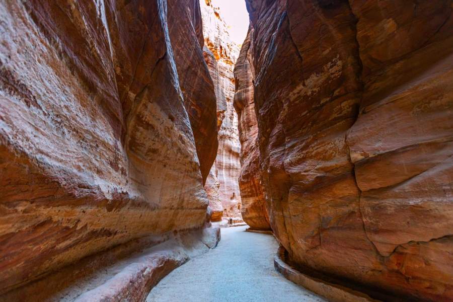The Siq, the spectacular and otherworldly narrow canyon leading to the ancient city of Petra, Jordan.